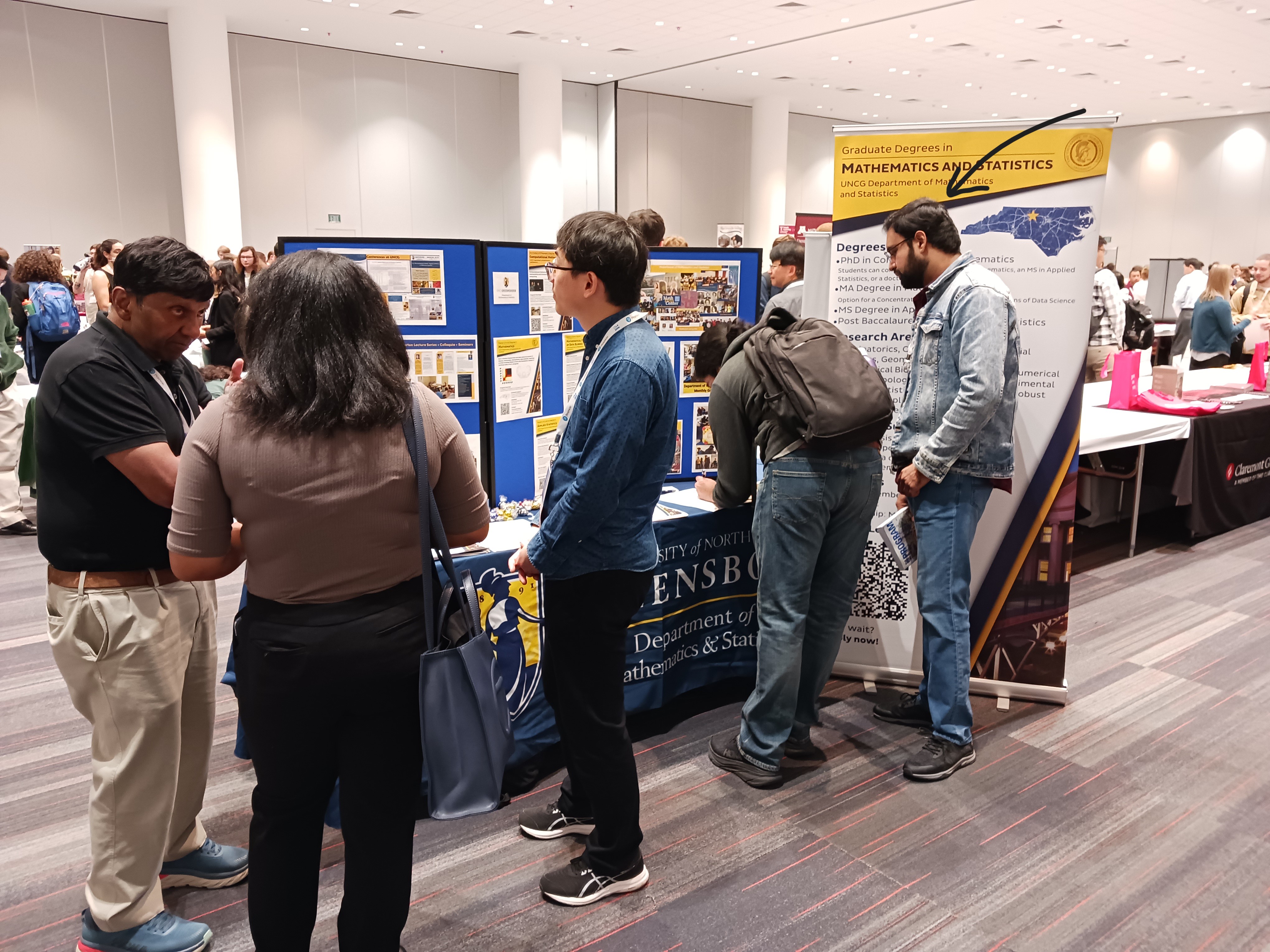 Interacting with prospective graduate students at graduate school fair